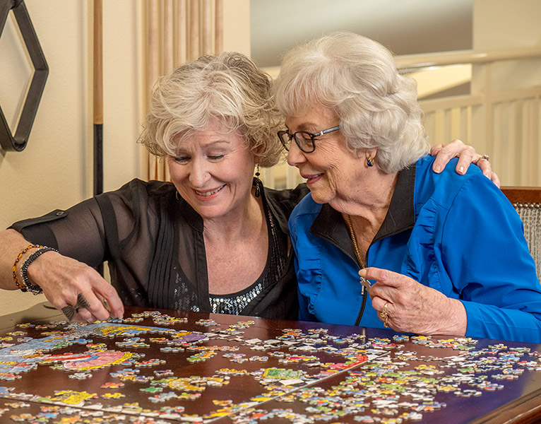 Puzzles with friends at Belmont Gardens